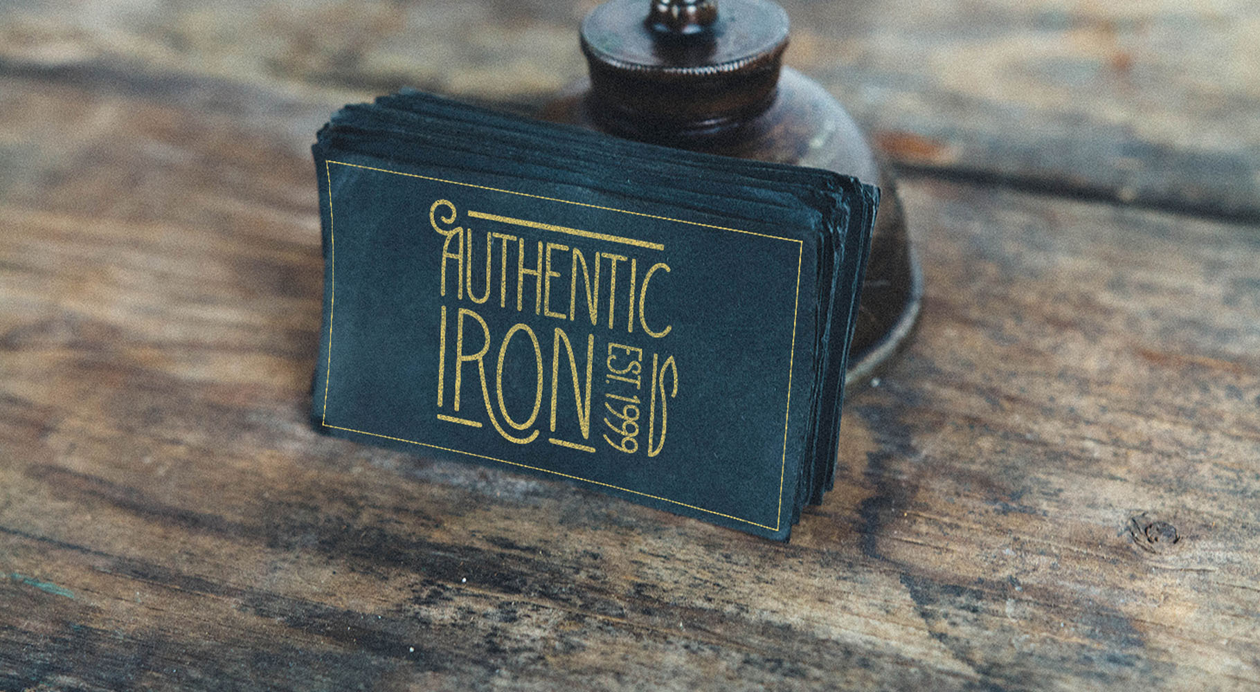 An image of a business card for Authentic Iron.